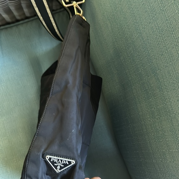 This is a black Prada crossbody with matching wallet. - Picture 2 of 8